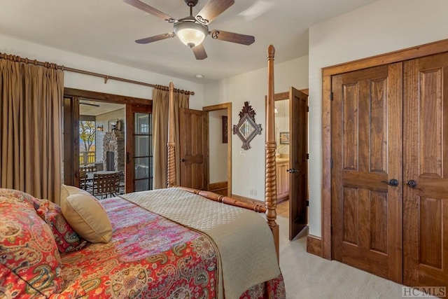 bedroom featuring ceiling fan and light carpet