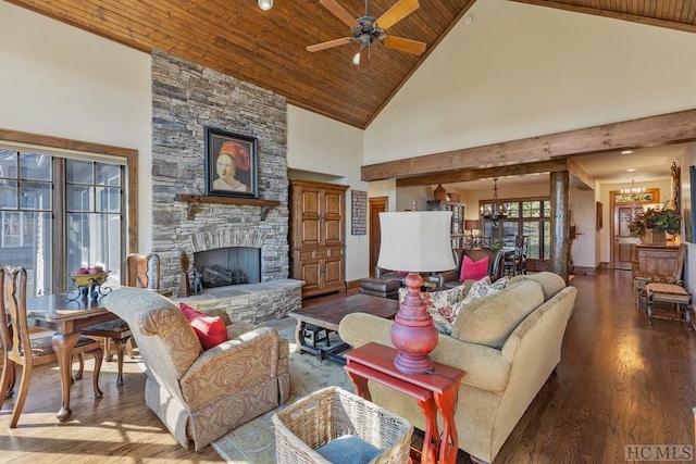 living room featuring a stone fireplace, high vaulted ceiling, wooden ceiling, hardwood / wood-style flooring, and ceiling fan with notable chandelier