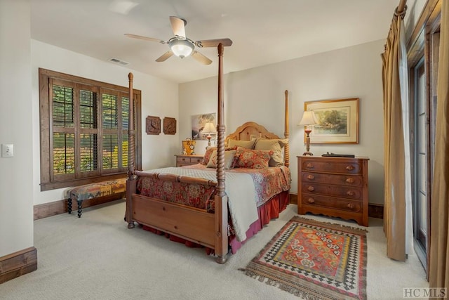 bedroom with light carpet and ceiling fan