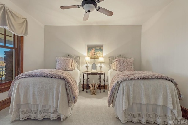 bedroom featuring ceiling fan and carpet flooring