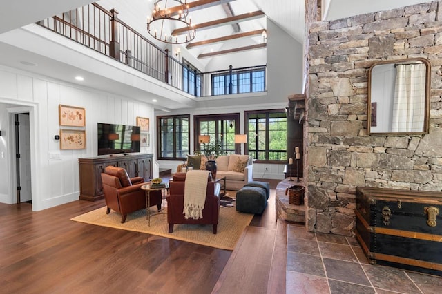 248 Drystack Way, Cashiers, NC 28717 - living room featuring wood finished floors, high vaulted ceiling, a chandelier, beamed ceiling, and baseboards
