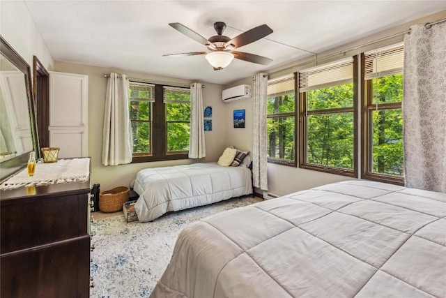 38 Lonely Mountain Dr Unit 24-A, Sapphire, NC 28774 - bedroom featuring an AC wall unit, multiple windows, ceiling fan, and baseboard heating