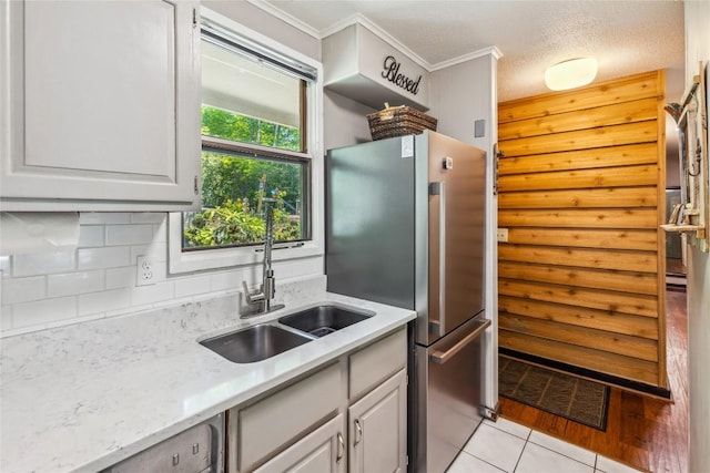 38 Lonely Mountain Dr Unit 24-A, Sapphire, NC 28774 - kitchen with freestanding refrigerator, ornamental molding, decorative backsplash, dishwashing machine, and light tile patterned flooring