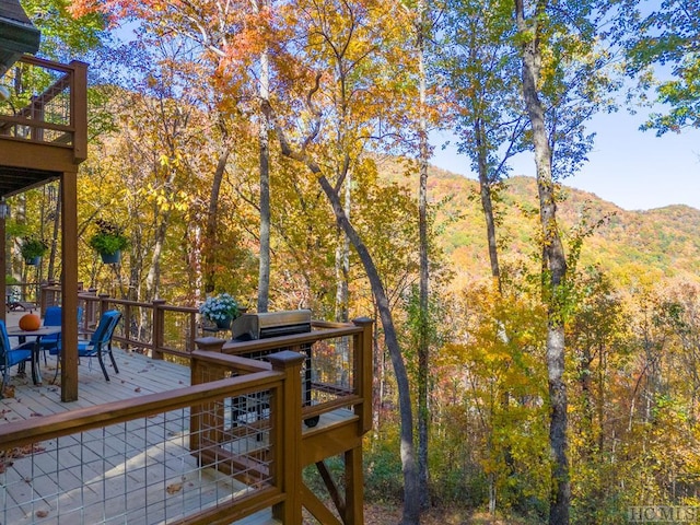 wooden deck with a mountain view