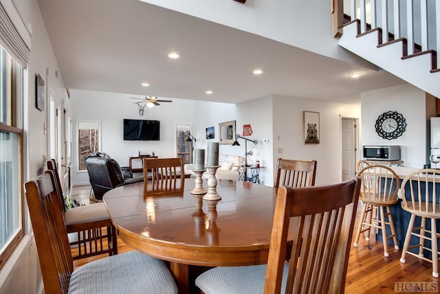 dining area featuring ceiling fan and wood-type flooring