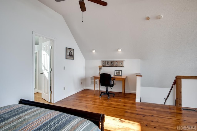 bedroom featuring light hardwood / wood-style floors and vaulted ceiling