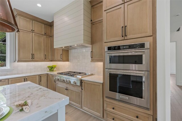 2608 Magnolia Dr, Highlands, NC 28741 - kitchen with stainless steel appliances, custom range hood, light wood-style floors, backsplash, and recessed lighting