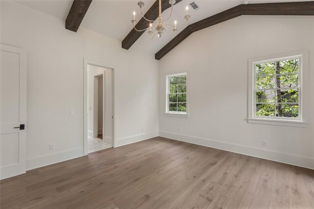 2608 Magnolia Dr, Highlands, NC 28741 - empty room with a chandelier and wood finished floors