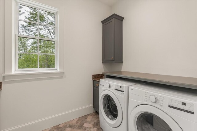 2608 Magnolia Dr, Highlands, NC 28741 - washroom with separate washer and dryer, cabinet space, and healthy amount of natural light