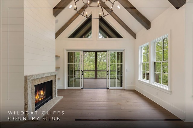 2608 Magnolia Dr, Highlands, NC 28741 - unfurnished living room with beamed ceiling, high vaulted ceiling, wood finished floors, and a premium fireplace