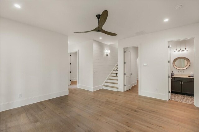 2608 Magnolia Dr, Highlands, NC 28741 - unfurnished living room with stairway, a ceiling fan, light wood-style floors, and recessed lighting