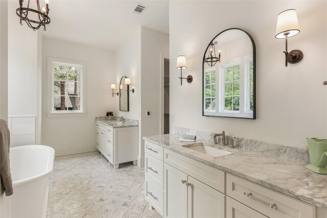 2608 Magnolia Dr, Highlands, NC 28741 - full bathroom featuring a soaking tub, two vanities, and a chandelier