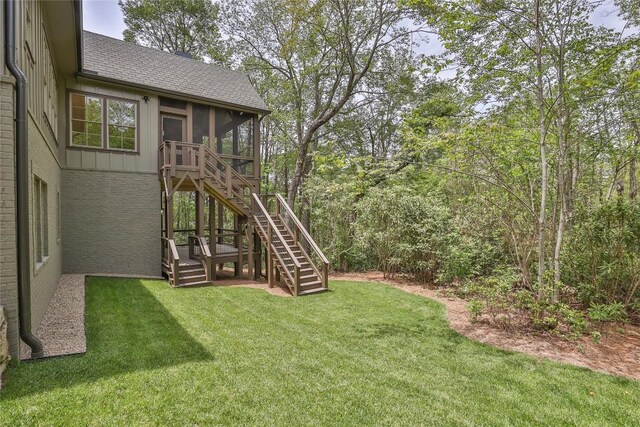 2608 Magnolia Dr, Highlands, NC 28741 - view of green lawn featuring stairway and a sunroom