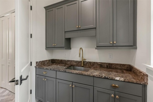2608 Magnolia Dr, Highlands, NC 28741 - kitchen featuring gray cabinetry and dark stone countertops