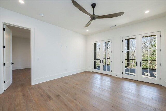 unfurnished room with recessed lighting, french doors, a ceiling fan, and wood finished floors