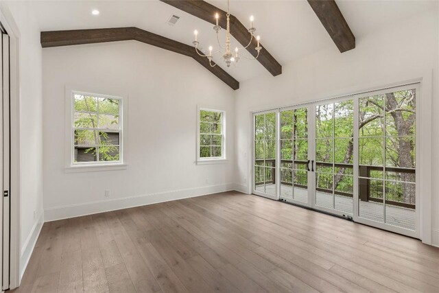 2608 Magnolia Dr, Highlands, NC 28741 - empty room with a chandelier, beamed ceiling, hardwood / wood-style flooring, and high vaulted ceiling