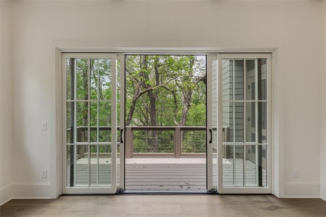 2608 Magnolia Dr, Highlands, NC 28741 - doorway to outside featuring baseboards and wood finished floors