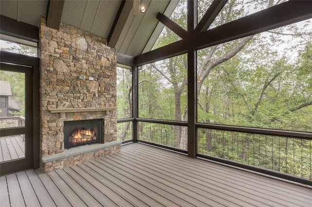 2608 Magnolia Dr, Highlands, NC 28741 - unfurnished sunroom featuring a stone fireplace