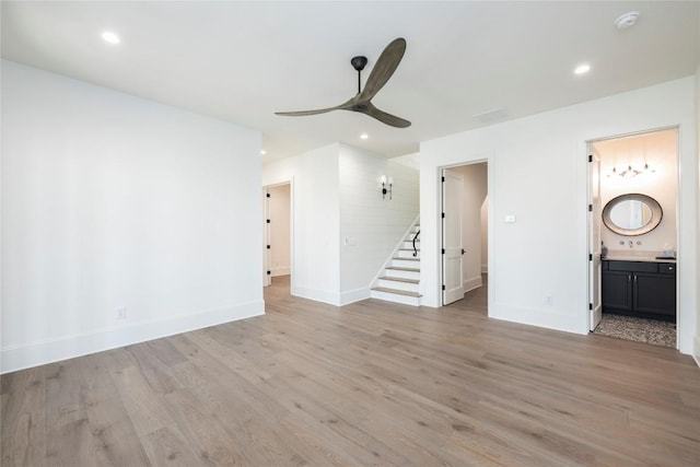 full bath featuring a freestanding bath, a notable chandelier, and baseboards