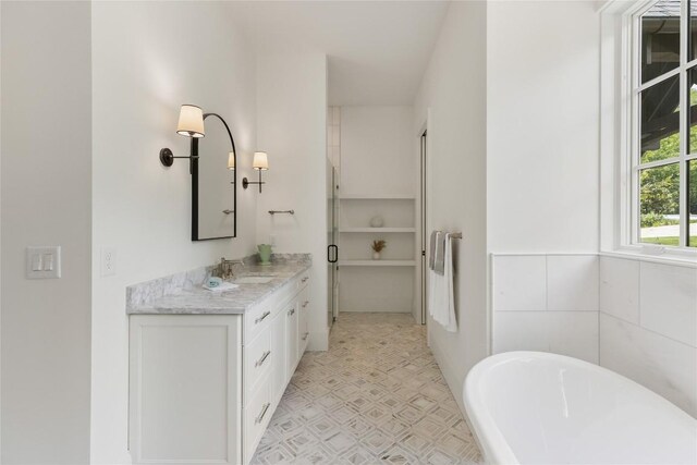 2608 Magnolia Dr, Highlands, NC 28741 - bathroom with vanity, a freestanding bath, tile patterned floors, and a shower stall