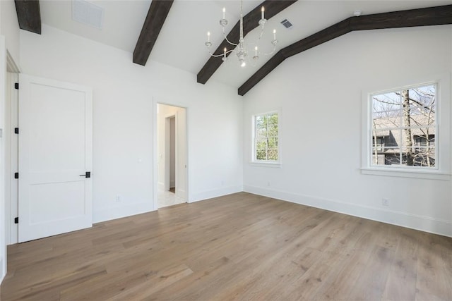 unfurnished bedroom with a chandelier, wood finished floors, lofted ceiling with beams, and visible vents