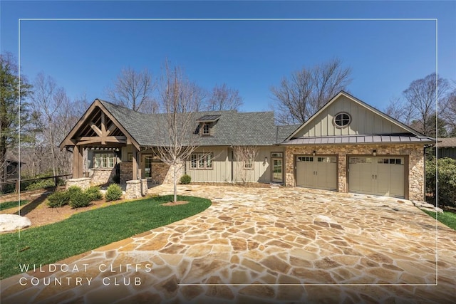 craftsman-style home featuring roof with shingles, driveway, board and batten siding, a garage, and fence
