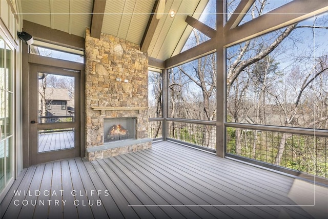 unfurnished sunroom with beam ceiling