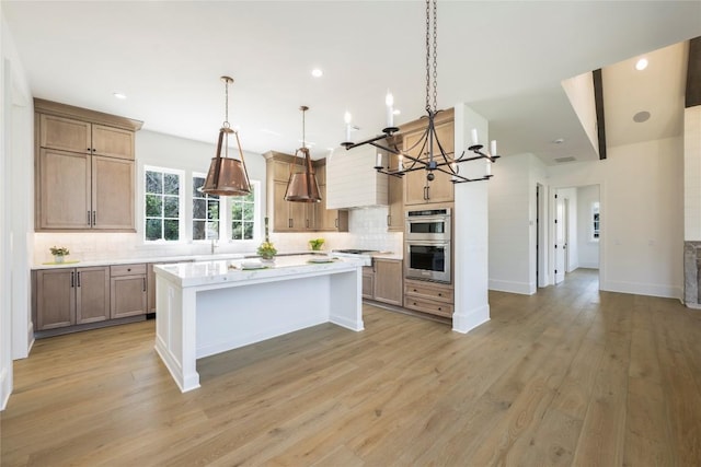 unfurnished living room featuring beamed ceiling, light wood-type flooring, beverage cooler, and an inviting chandelier
