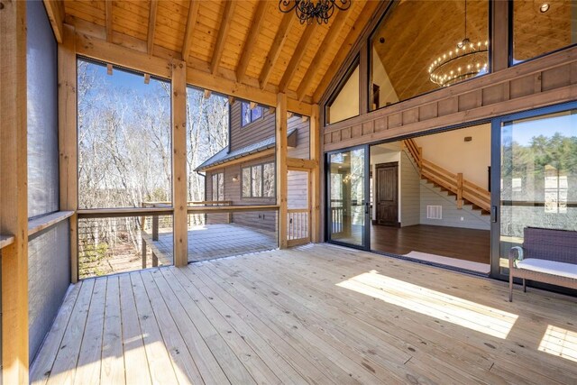 1086 Roaming Rd, Glenville, NC 28736 - unfurnished sunroom with a notable chandelier, a healthy amount of sunlight, and beamed ceiling