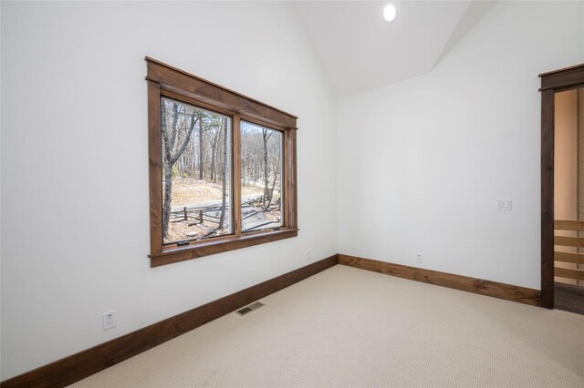 1086 Roaming Rd, Glenville, NC 28736 - unfurnished room featuring carpet floors, baseboards, lofted ceiling, and visible vents