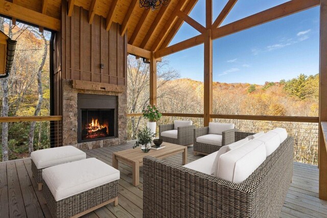 1086 Roaming Rd, Glenville, NC 28736 - wooden terrace with an outdoor living space with a fireplace