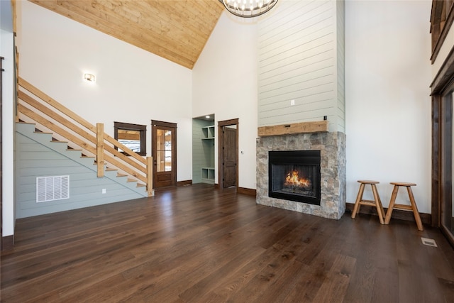 1086 Roaming Rd, Glenville, NC 28736 - unfurnished living room with stairs, wooden ceiling, a fireplace, wood finished floors, and visible vents