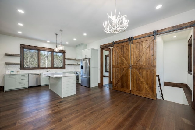 1086 Roaming Rd, Glenville, NC 28736 - kitchen featuring light countertops, stainless steel appliances, dark wood-type flooring, a sink, and open shelves