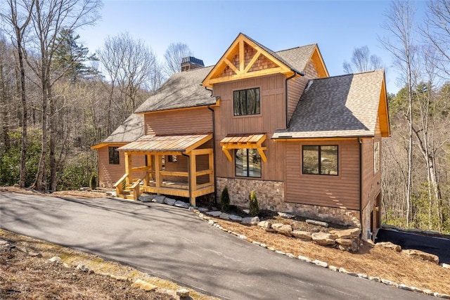 1086 Roaming Rd, Glenville, NC 28736 - chalet / cabin featuring stone siding, aphalt driveway, a chimney, roof with shingles, and covered porch