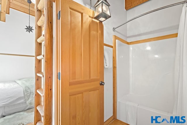 full bathroom with shower / bathtub combination with curtain