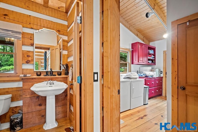 bathroom featuring wood ceiling, vaulted ceiling, washer and clothes dryer, and hardwood / wood-style floors