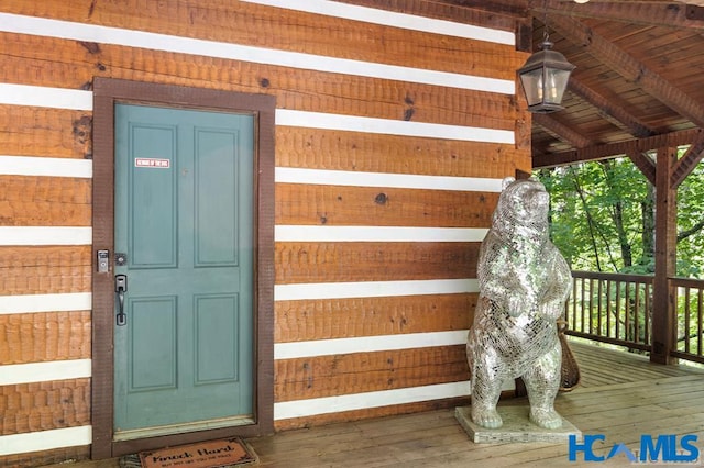 property entrance with brick siding