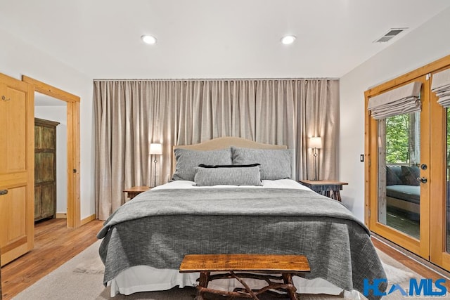 bedroom with light wood-style floors, recessed lighting, access to exterior, and visible vents