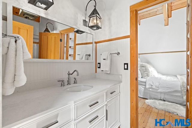 bathroom with wood-type flooring and vanity