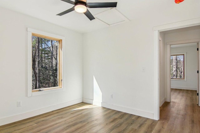 365 Cherokee Cir, Lake Toxaway, NC 28747 - empty room featuring healthy amount of natural light, wood finished floors, and a ceiling fan