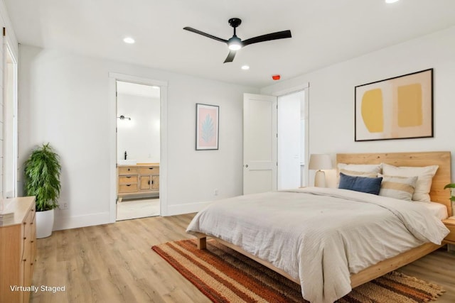 bedroom with recessed lighting, ensuite bath, light wood-style flooring, and baseboards