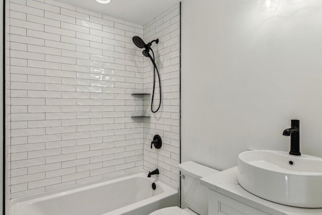 bathroom with shower / bathtub combination, a sink, and toilet