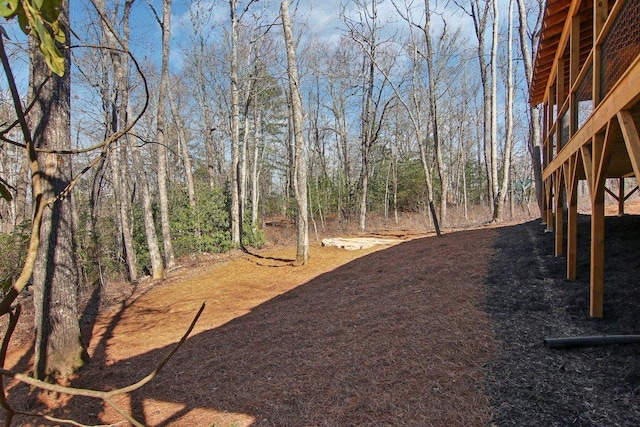 365 Cherokee Cir, Lake Toxaway, NC 28747 - view of yard featuring a wooded view and a wooden deck