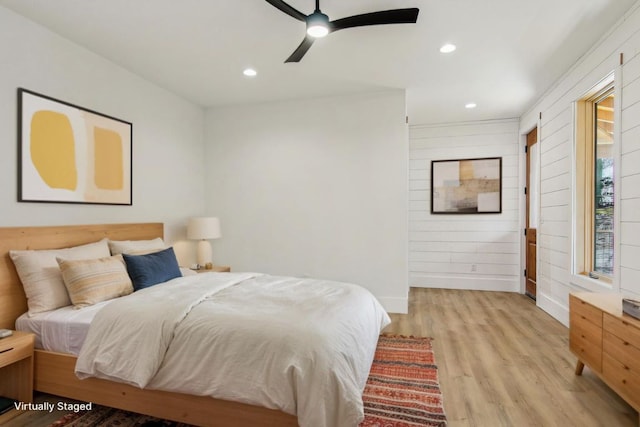 bedroom featuring a ceiling fan, recessed lighting, light wood-style flooring, and baseboards