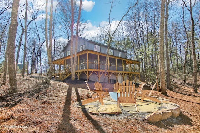 365 Cherokee Cir, Lake Toxaway, NC 28747 - back of house with a sunroom, stairway, and a deck