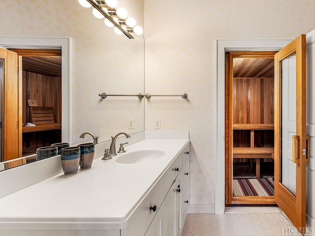 bathroom featuring tile patterned flooring and vanity