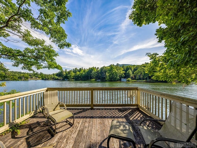 view of dock featuring a deck with water view