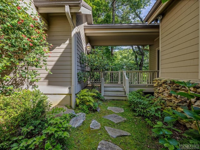 view of property exterior with a deck