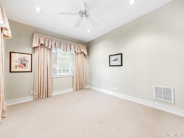 unfurnished room with ceiling fan and carpet floors