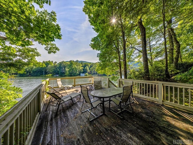 wooden deck featuring a water view